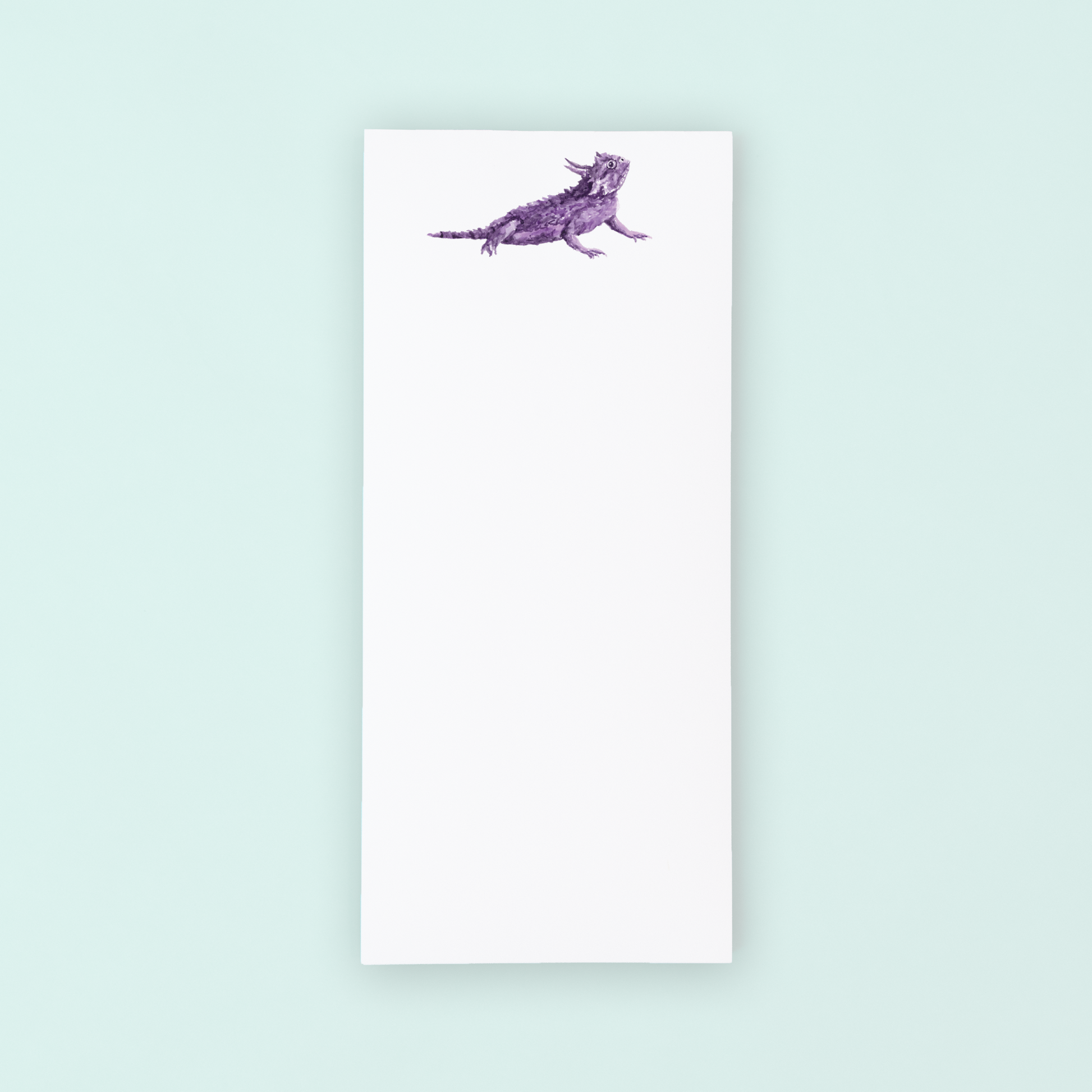 Notebook with a purple dog illustration on a light blue background