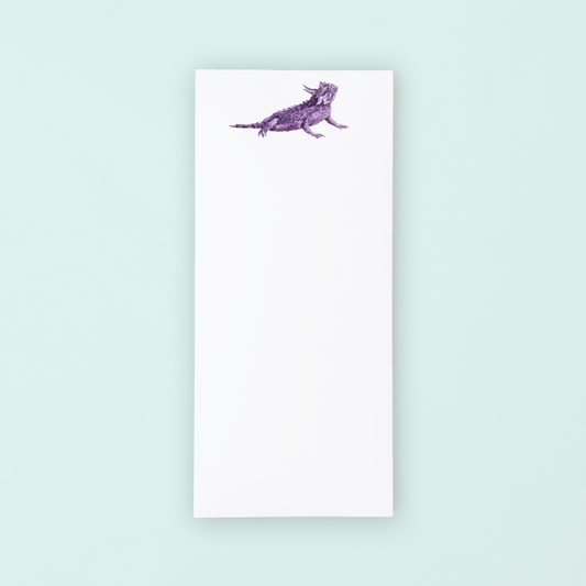 Notebook with a purple dog illustration on a light blue background