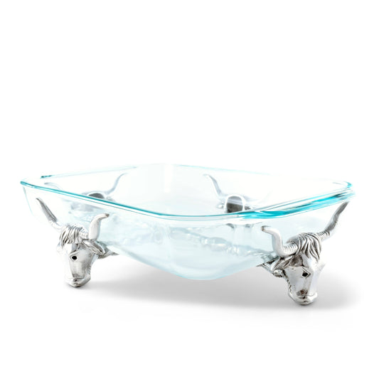 Glass bowl with silver bull handles on a white background